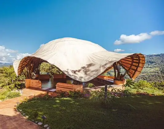The bamboo Air Temple at Holos Basecamp, an open-air structure overlooking the Diamante Valley