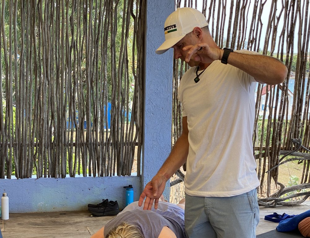 Dr. Matt Lyon guiding a guest through bodywork at the retreat
